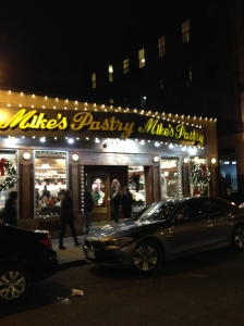 The front of Mike's Pastry, emblazoned with a regal golden color. 